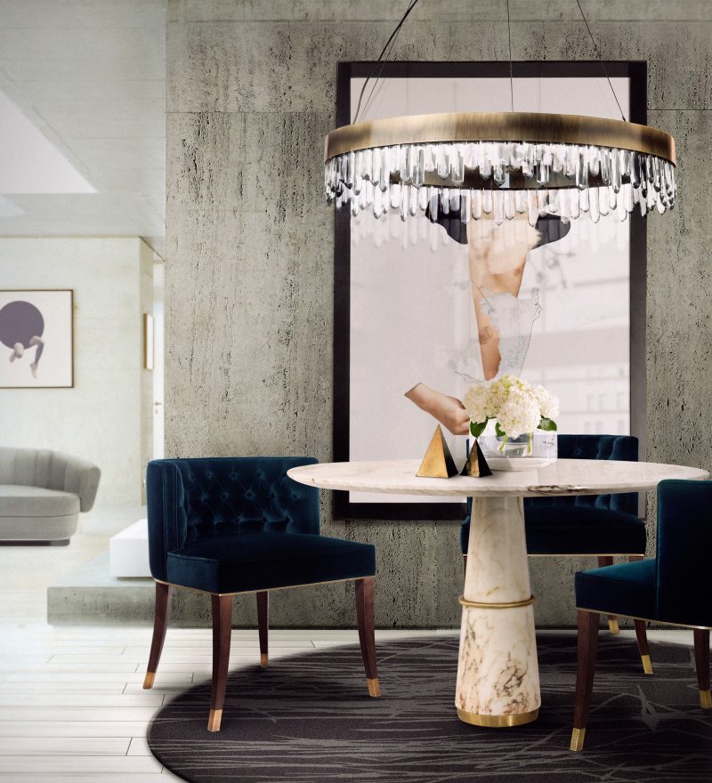 modern contemporary dining room with round black rug and velvet dining chair with round Agra rug and suspension lights