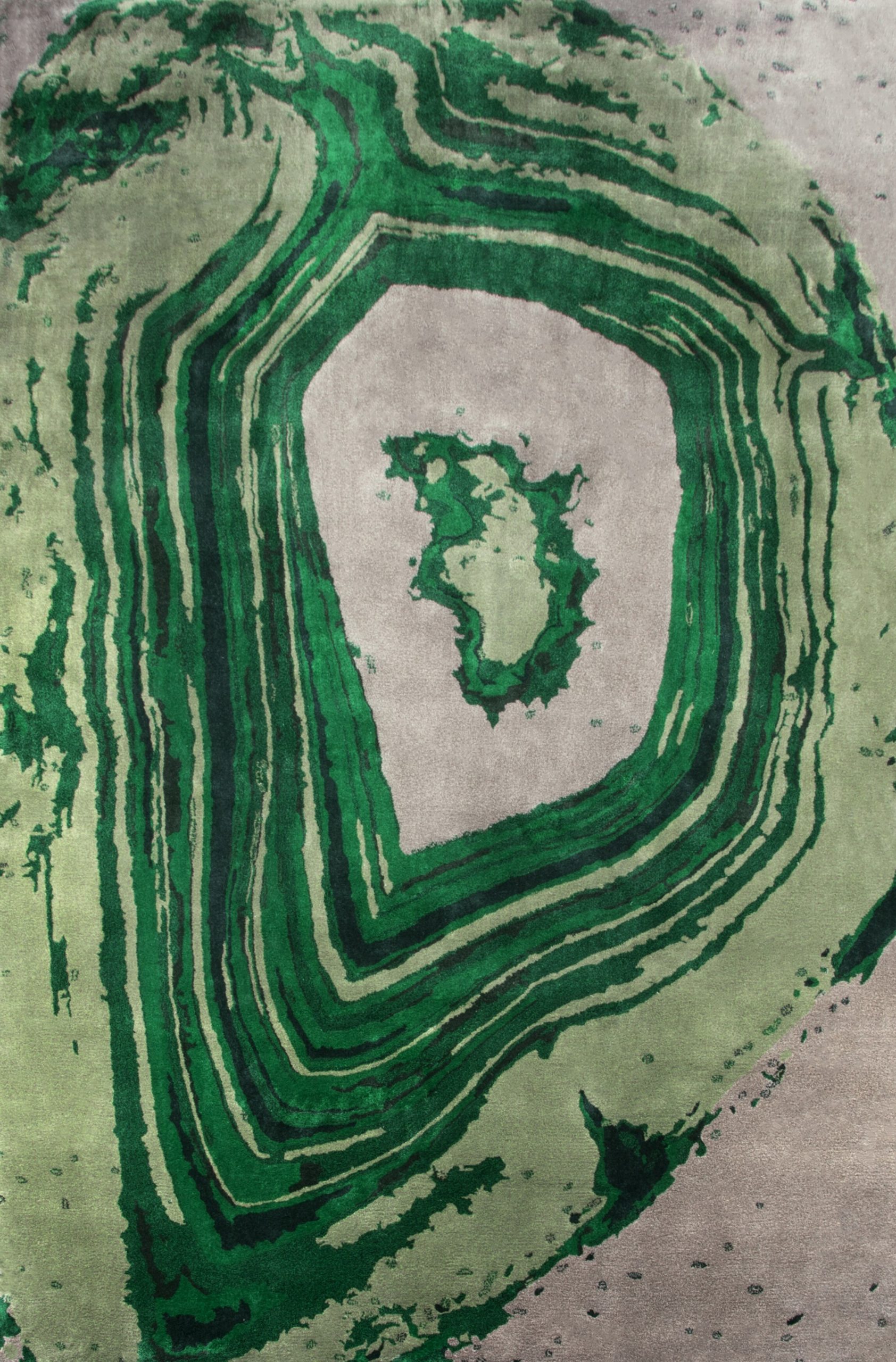 green area rug with an abstract pattern that resembles the inside of a gemstrone. The Most Popular Green Area Rugs for 2022