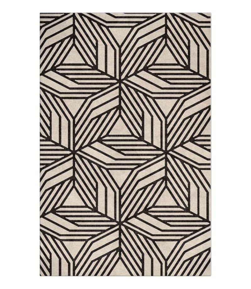 Top 5 classical rugs to make your home even more sophisticated Modern monochrome reading corner with the Cauca Rug, geometric pattern, black and white