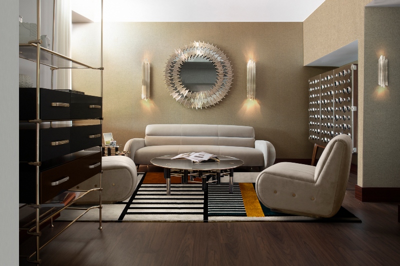 Mid-century living room with the gorgeous geometric PRISMA 1 RUG with blue, purple, and orange colors, mid century white couch, armchairs and center table. The Most Exquisite Artistic Rug Collection