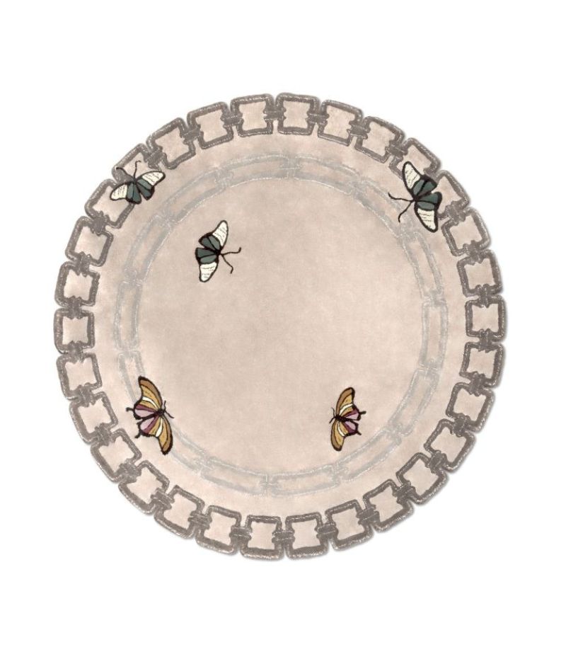Dining room rug inspirations: neutral round rug with butterflies as a design.