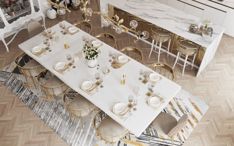 Colorful Dining Room Rug Ideas, Modern classic dining room with beautiful Xisto rug in gray, white and gold. Area rug with white dining table and golden dining chairs