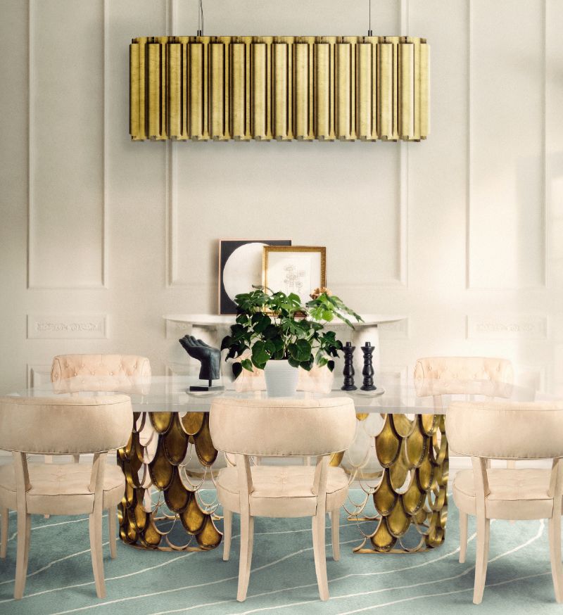 Which Type of Dining Room Rug is the Best for you? Modern classicdining room with the Warao Rug, white chairs and golden lights