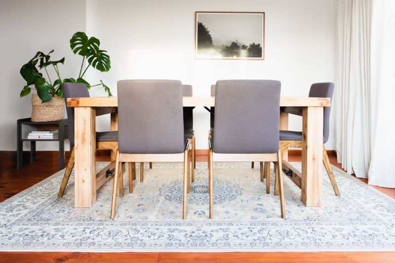 Area Rugs: How to Create A Luxurious Dining Room With Them modern contemporary dining room with white and blue area Rug