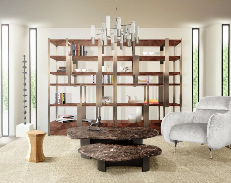 this is a modern contemporary living room with brown area rug, center table, gray armchair, silver lights.