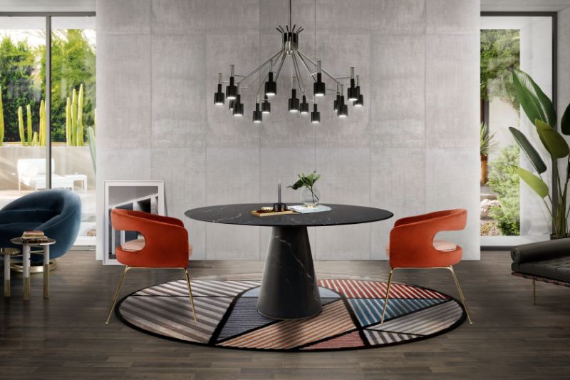 Colorful Dining Room Rug Ideas midcentury dining room with colorful round lola rug, with round dining table in marbled, mid century dining chairs