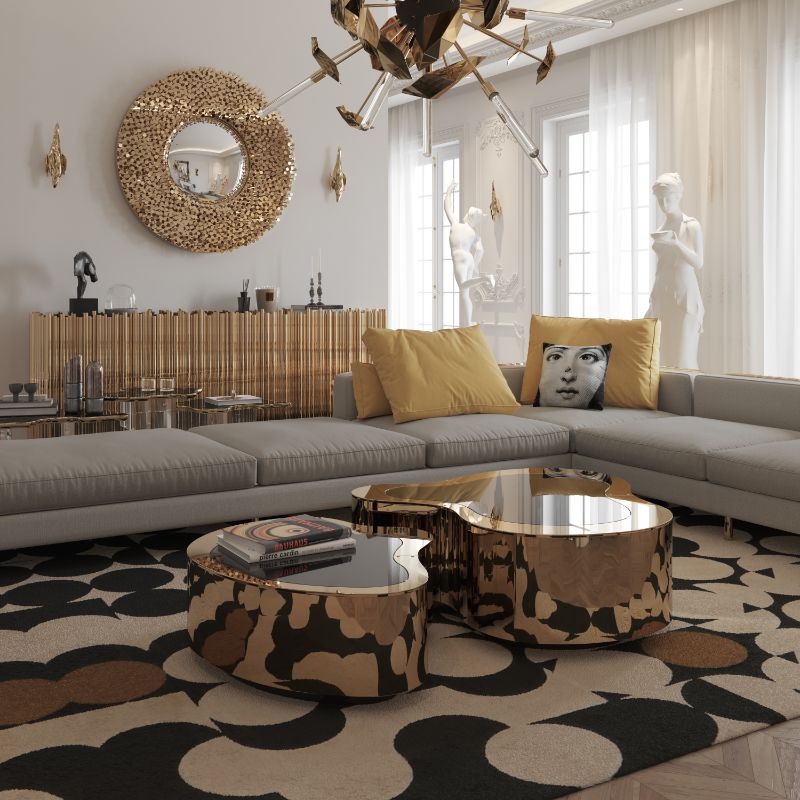 Modern living room with the fabulous Yarsa Rug, golden center table and gray sofa. The living room is decorated with a golden mirror and the supernova hanging lights.