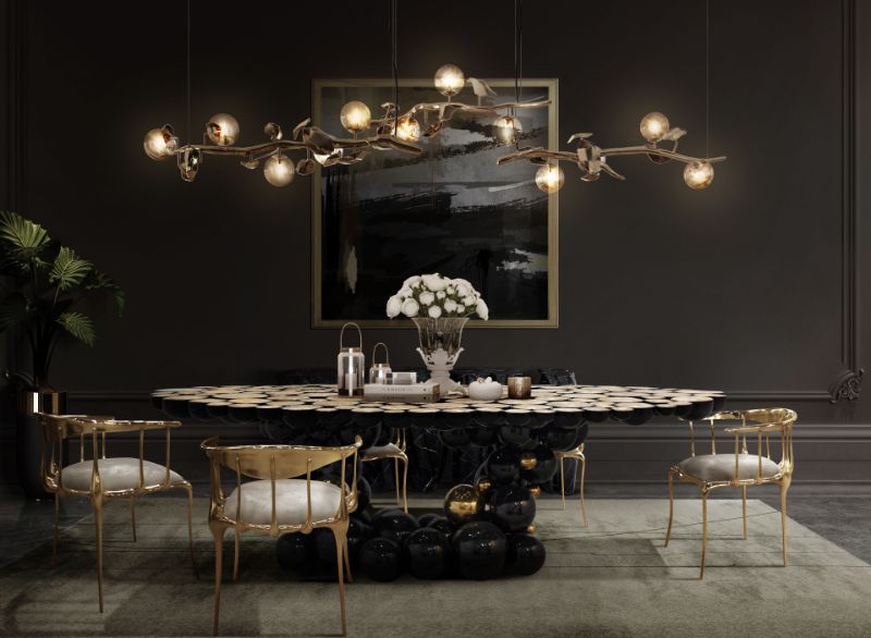 sophisticated dining room with a beige area rug, n°11 chairs from boca do lobo and haning lights
