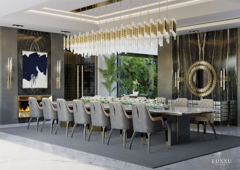 luxury dining room with gray area rug and gold hanging lights
