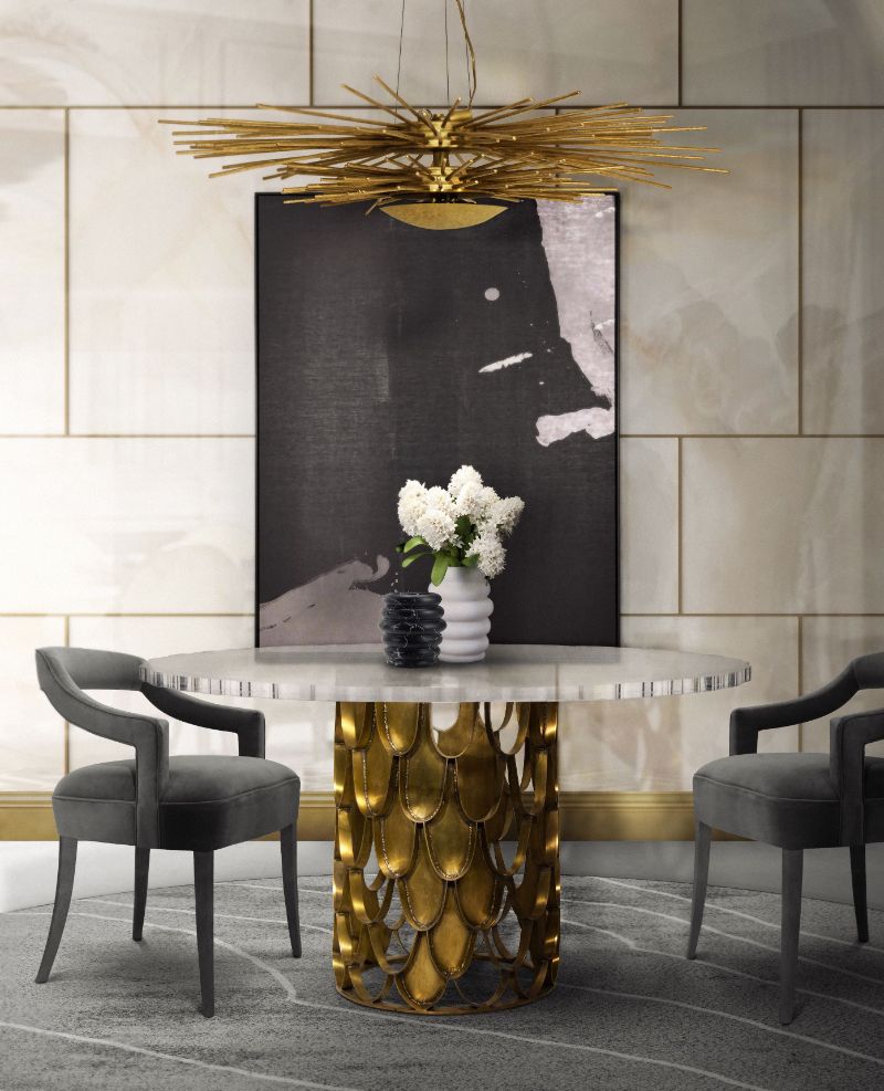 Stylish modern dining room with Warao rug with gold round dining room and gray dining chairs