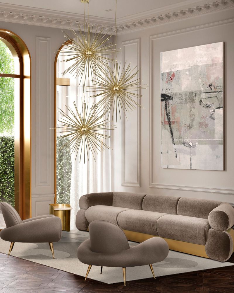 Modern living room with gray area rug, armchairs and golden lights