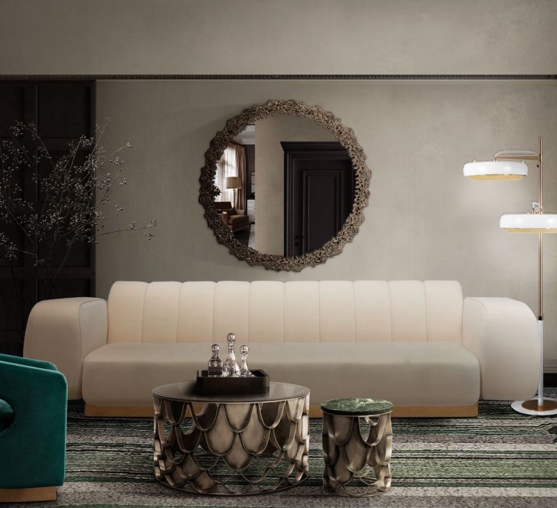 Modern contemporary living room with Royalis designer rug, white sofa, round mirror and golden Koi center table