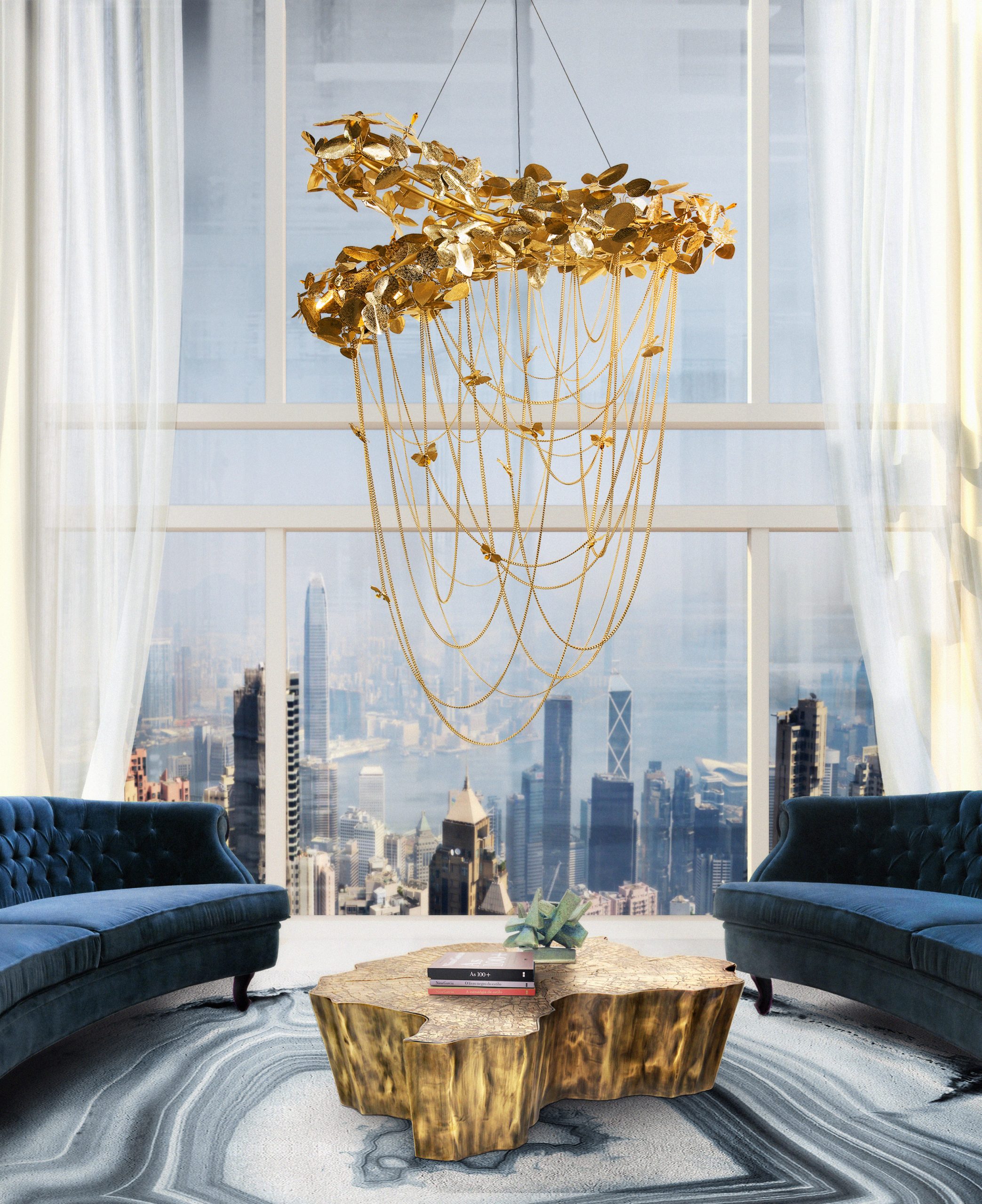 Elegant modern living rom with blue agatha rug with golden hanging lights and  blue velvet sofa and gold center table