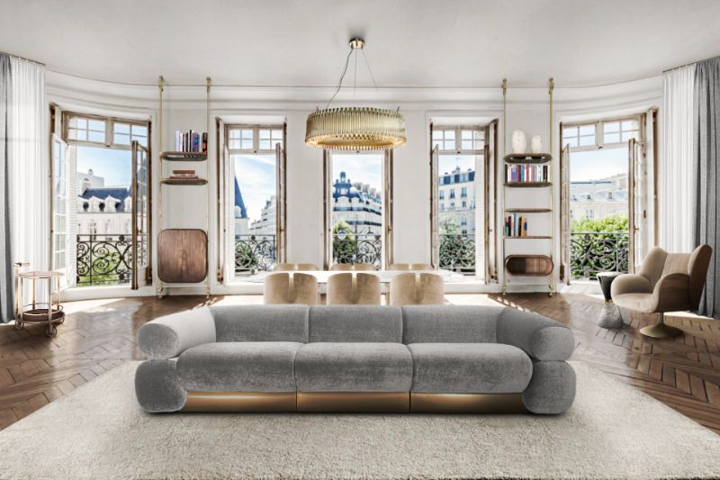Modern living room with gray sofa, area rug and golden chandelier