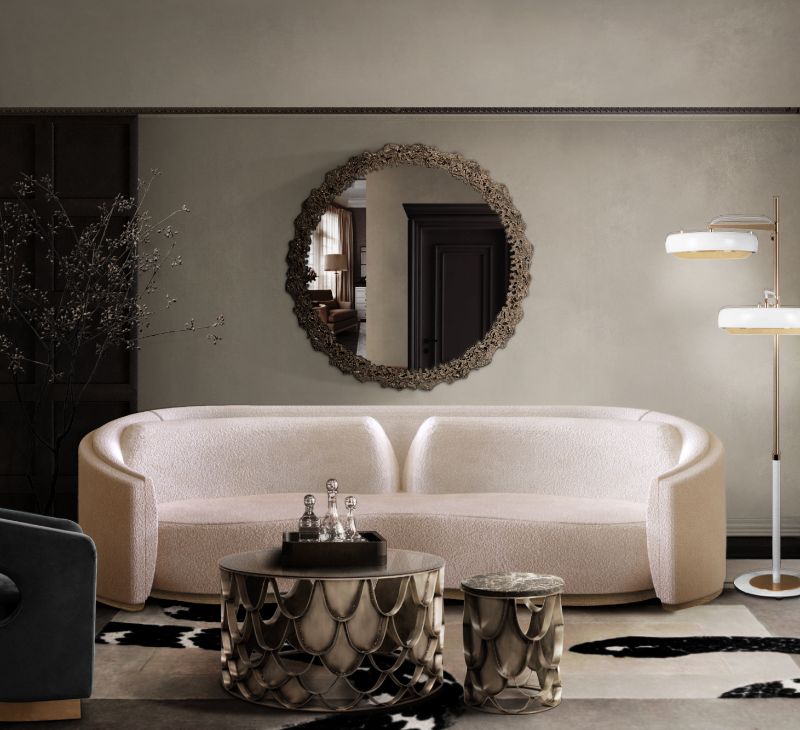 Modern contemporary living room with the Imperial snake rug, a koi center table and white sofa and above it, a round mirror