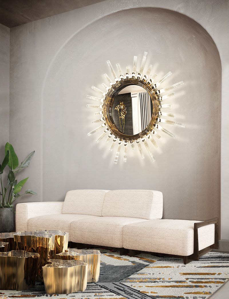 Modern and classic living room with fabulous Xisto rug in gray and gold, with center table and white sofa with golden round mirror