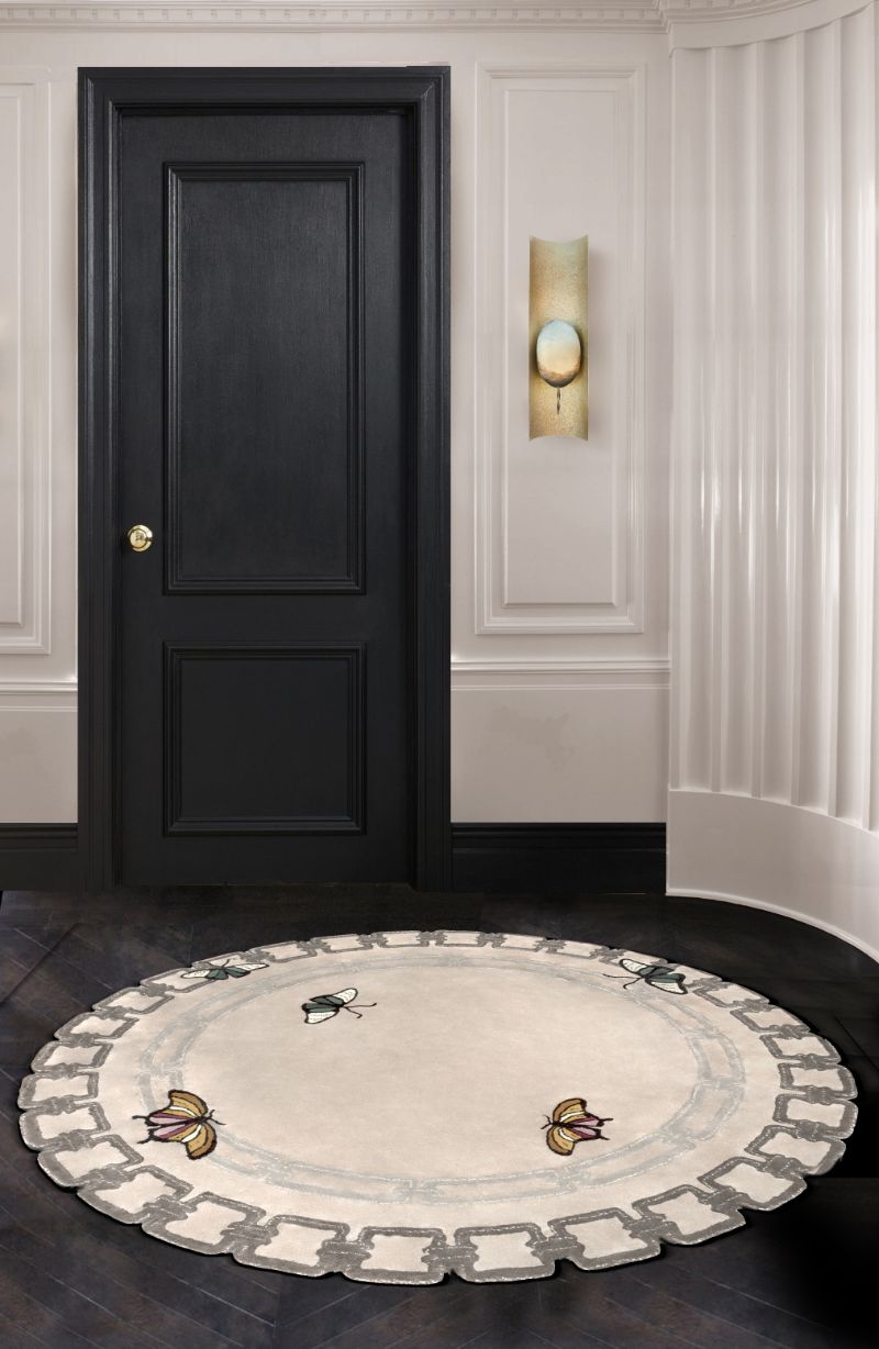 Minimalist entryway with round metamorphosis rug