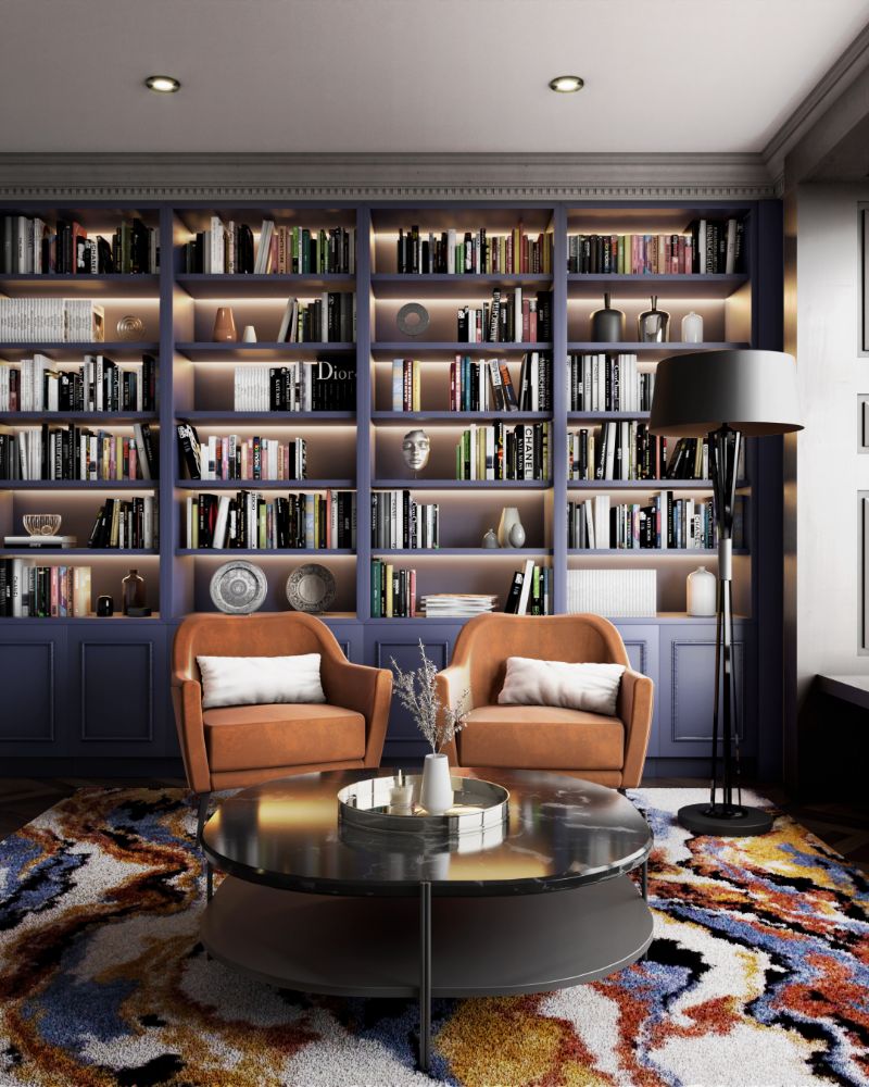 modern contemporary library with a colorful rug, the LALAND RUG with the Miles floor lamp and dandrige armchairs.
