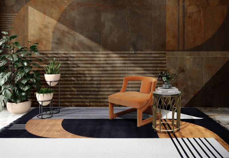 modern midcentury reading corner with ANTELOPE RUG in black and white with a pop of color and orange armchair. Modern Home Decor Ideas: 10 Dashing Rugs To Style A Room