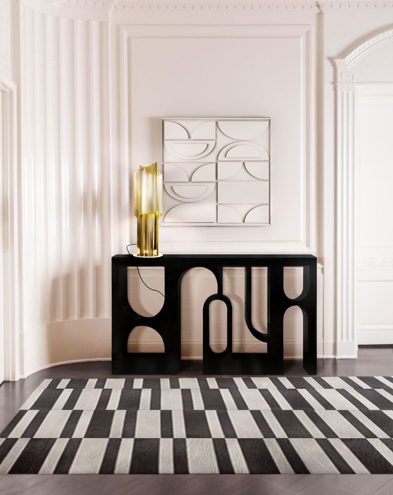 modern classic hallway with black and white leather rug, the MILA RUG has a simple design that combines nicely with thie rest of the modern furniture in this ambient. The Most Trendy Rugs For An Exquisite Interior in 2022