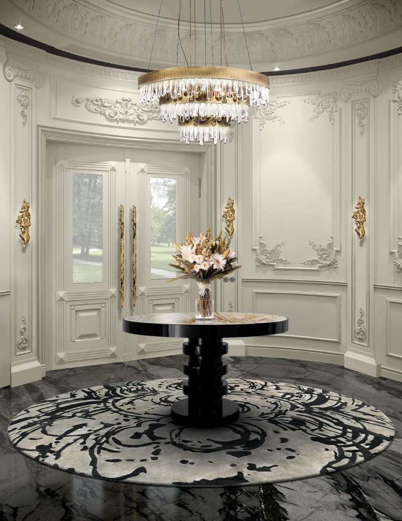 Luxurious modern entryway with round rug and chandelier. The Finest Modern Rug Ideas For 2022