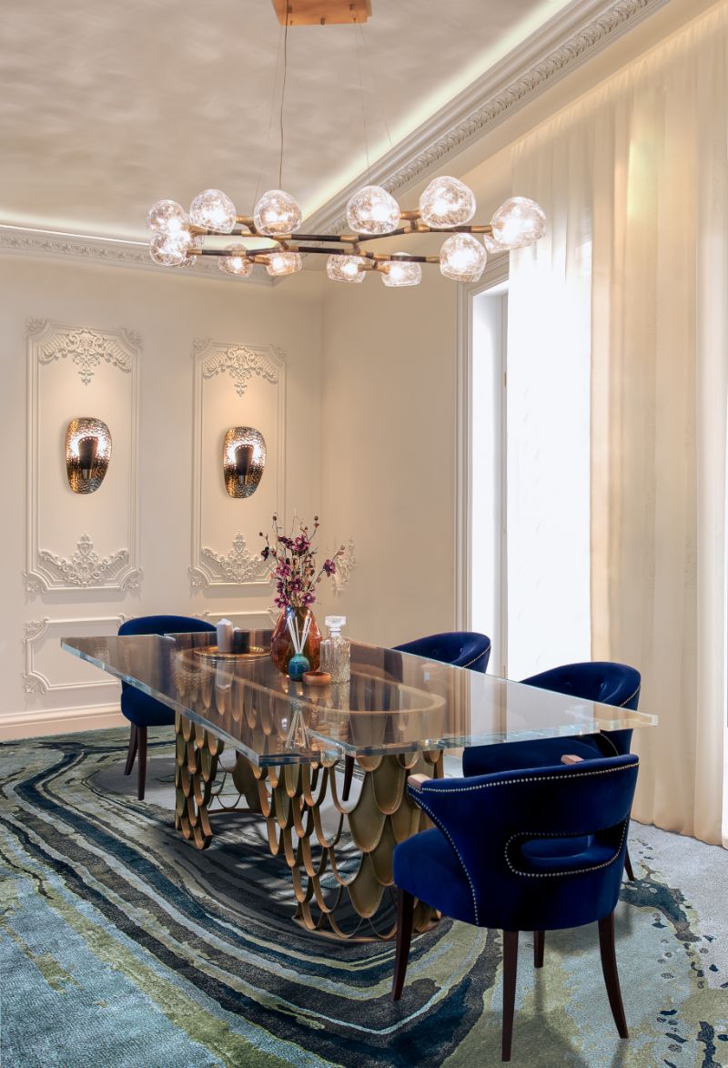 Blue contemporary dining room rug with velvet chairs and luxurious table. The Best Dining Room Rug Ideas To Amaze Your Guests