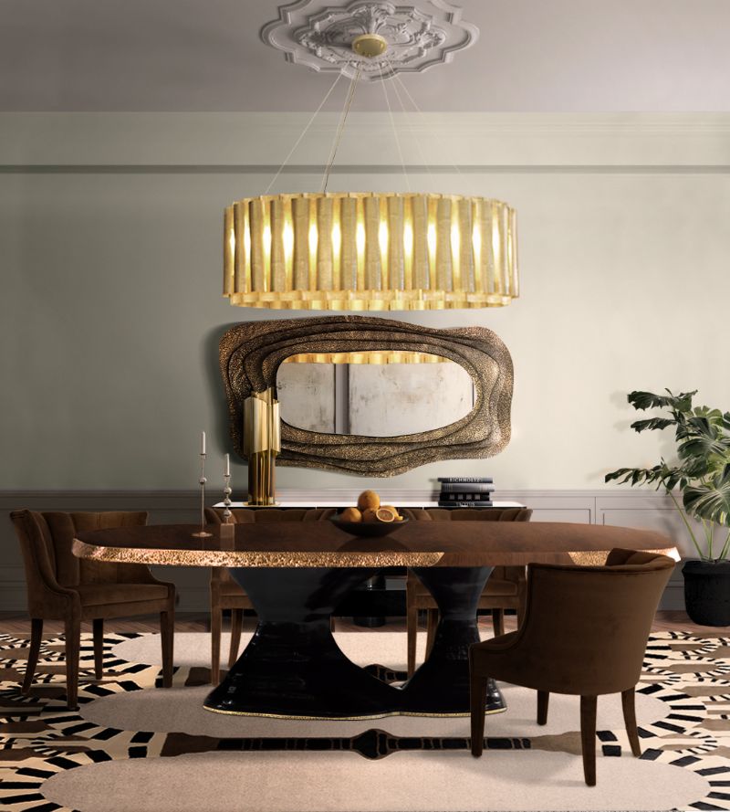 Dining room rug inspirations: modern contemporary dining area with neutral area rug and suspension lights that shine upon the table and chairs