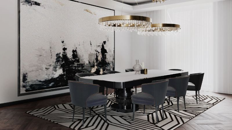 iSaloni 2022: modern dining room with black and white rug and dining table with suspension lights.