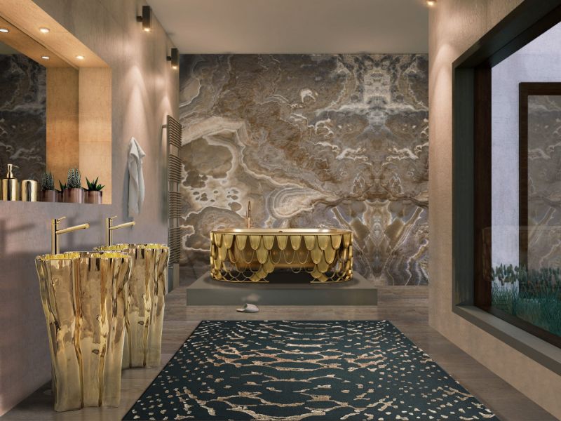 iSaloni 2022: luxurious bathroom decori with a dark blue and golden rug paired with a fancy golden bathtub.