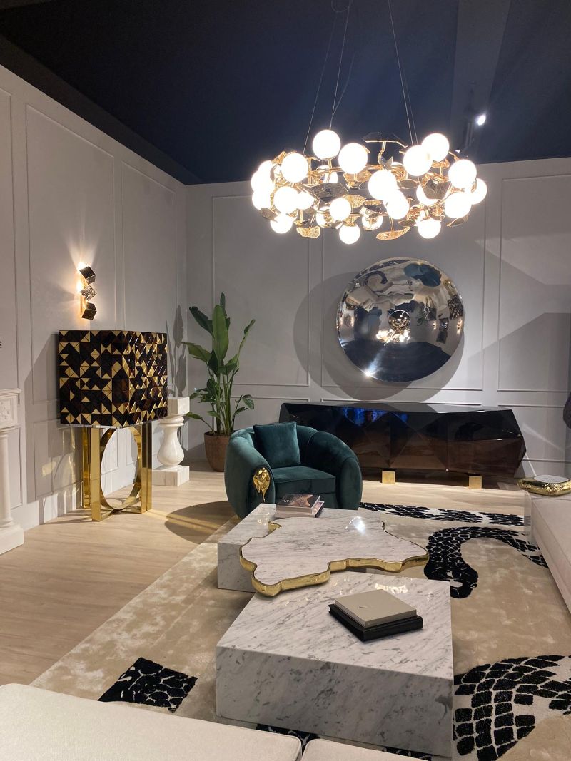 luxurious living room at iSaloni 2022, with area rug Imperial Snake and armchair with suspension lights