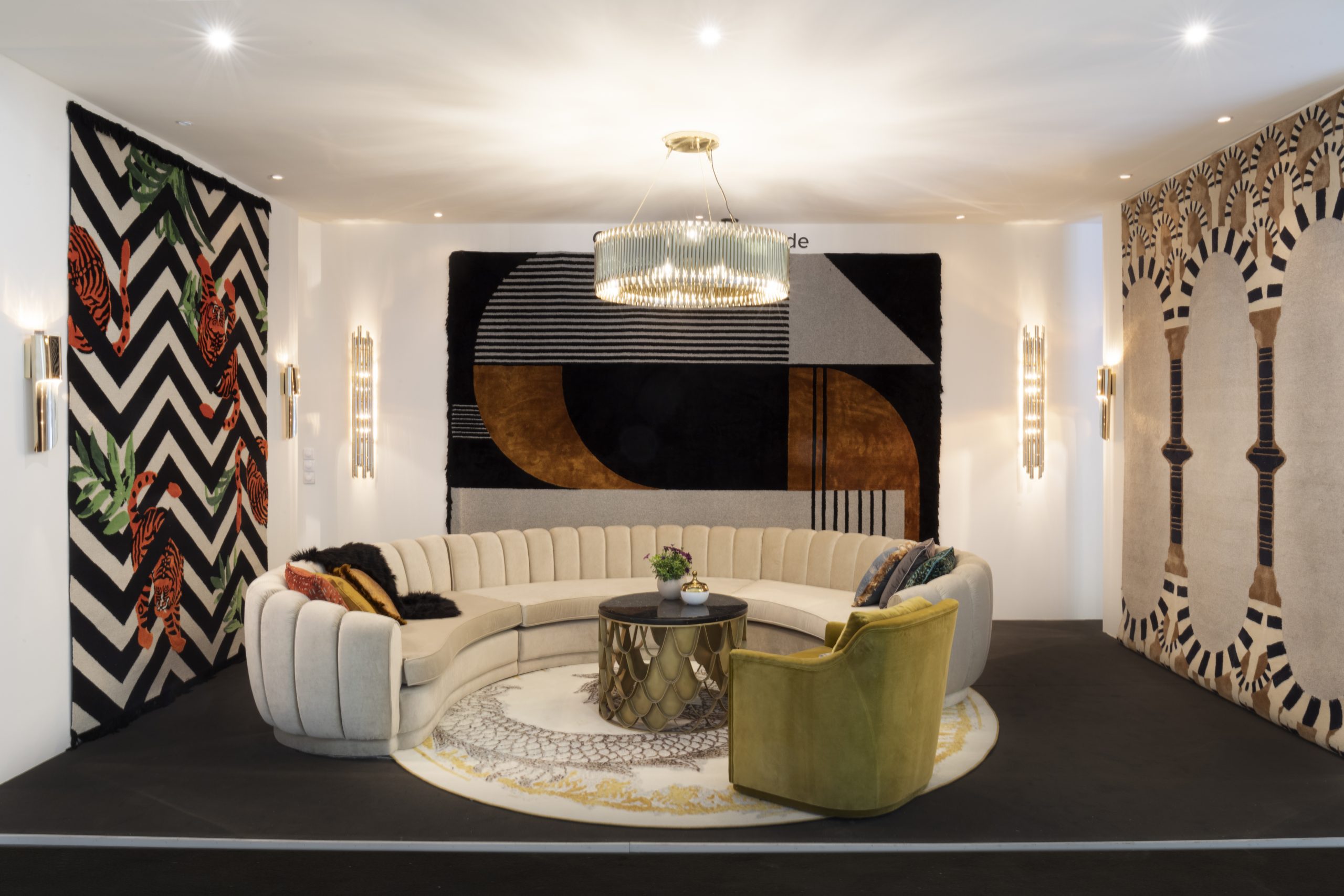 The Highlights of Milan Salone Del Mobile 2022 - modern contemporary living room design with round rug in silver and golden hues with wall rugs decorating the walls