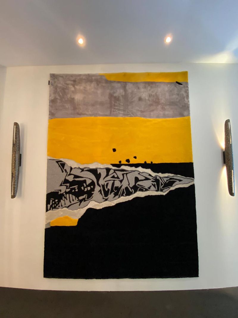Where To Find The Finest Luxury Rugs at iSaloni 2022 - The DISRUPTION RUG brings color and a revolutionary vibe to the stand.