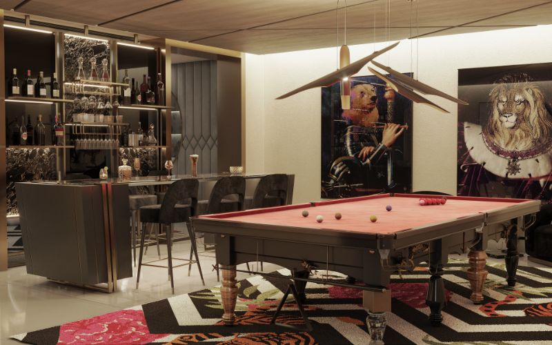 12 Rug Styling Ideas You Should Consider For Your Home. Luxurious playroom with a bar a pool game table that has a stunning black and white modern rug.