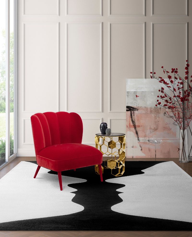 modern classic living room with black and white area rug with a simple design and red armchair. 5 Incredibly Useful Rug Ideas For A Modern Living Room