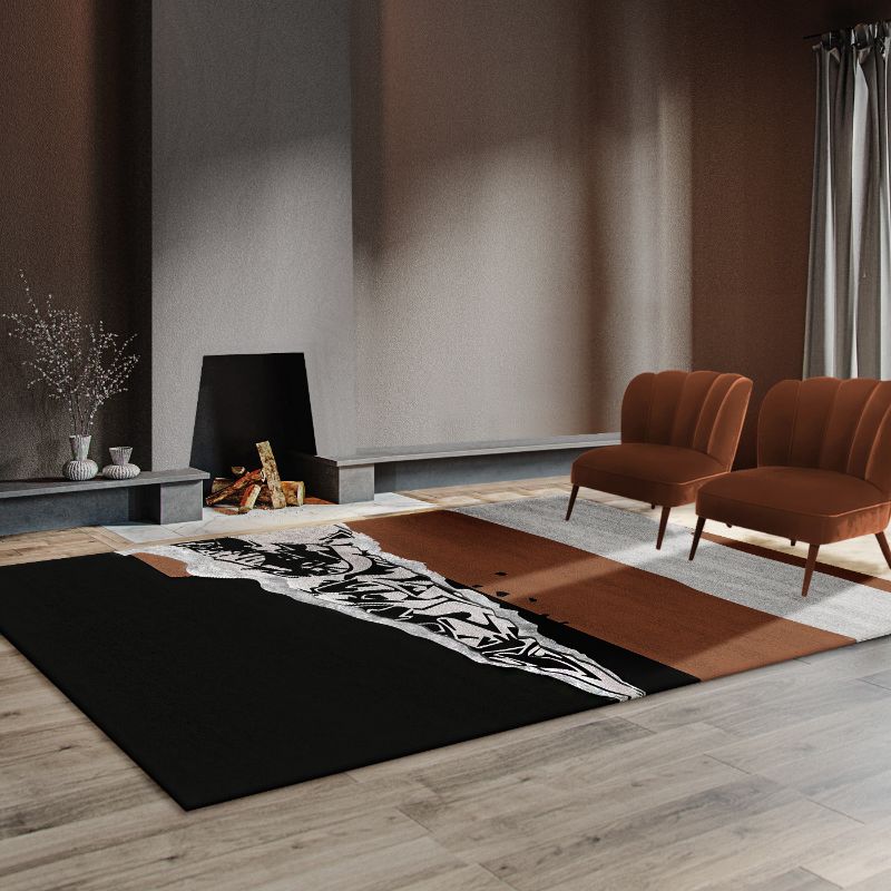 5 Incredibly Useful Rug Ideas For A Modern Living Room with black and brown rug and deep red armchairs for a fall decor