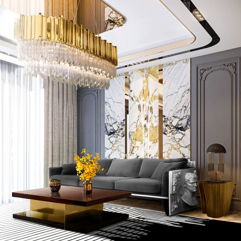 a luscious modern contemporary living room with a lot of incredible details. The black and white VALENCIA RUG is a stunning piece that contrasts with the center table and gray sofa and ceiling light pendant